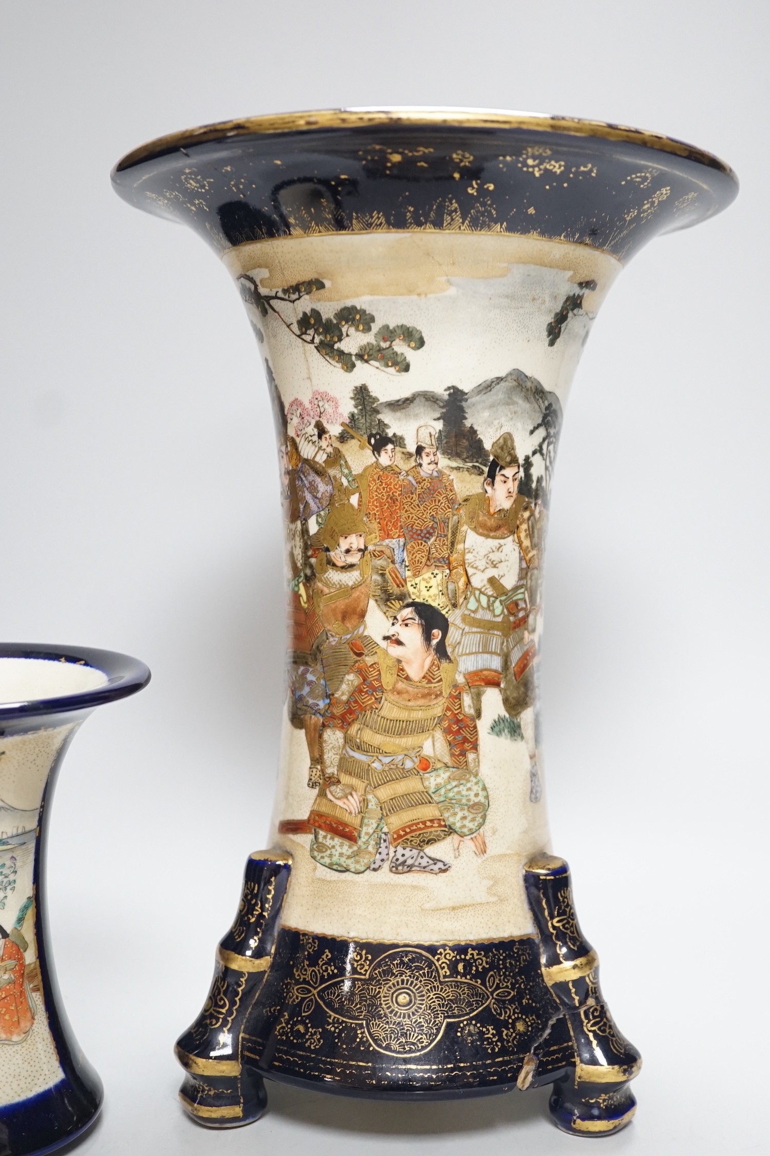 A Japanese Satsuma vase, a smaller vase two saucers and a cat, tallest vase 30cms high